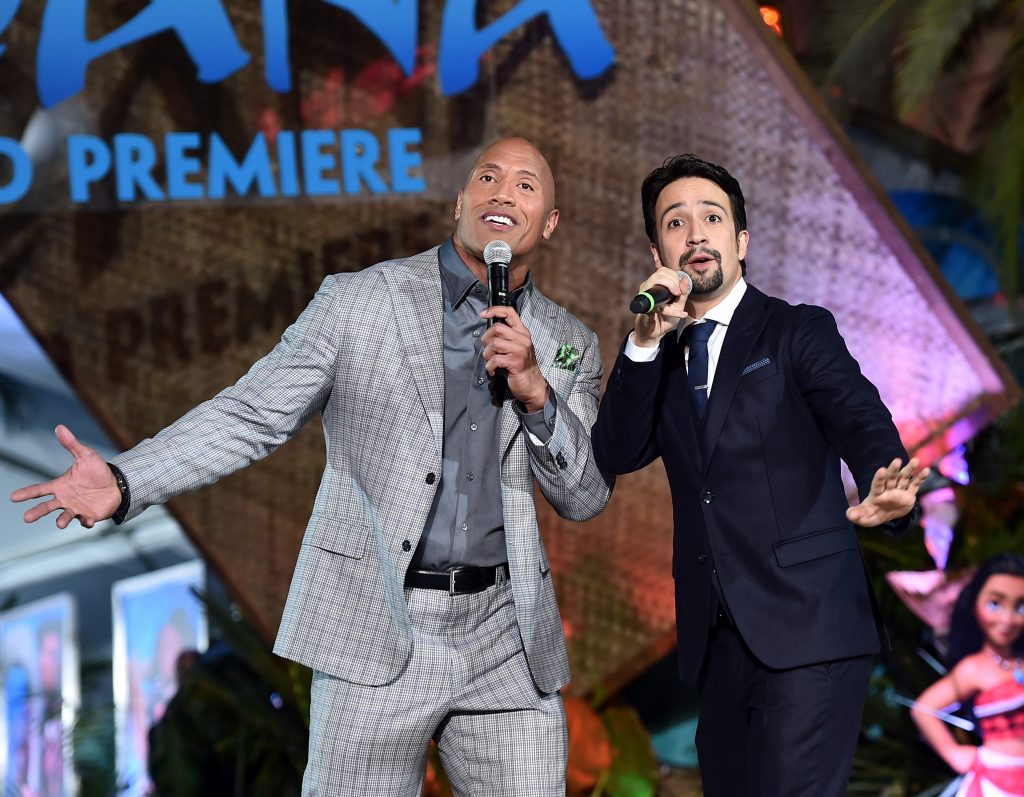 HOLLYWOOD, CA - NOVEMBER 14: Actor Dwayne Johnson (L) and songwriter Lin-Manuel Miranda perform onstage at The World Premiere of Disneys "MOANA" at the El Capitan Theatre on Monday, November 14, 2016 in Hollywood, CA. (Photo by Alberto E. Rodriguez/Getty Images for Disney) *** Local Caption *** Lin-Manuel Miranda; Dwayne Johnson